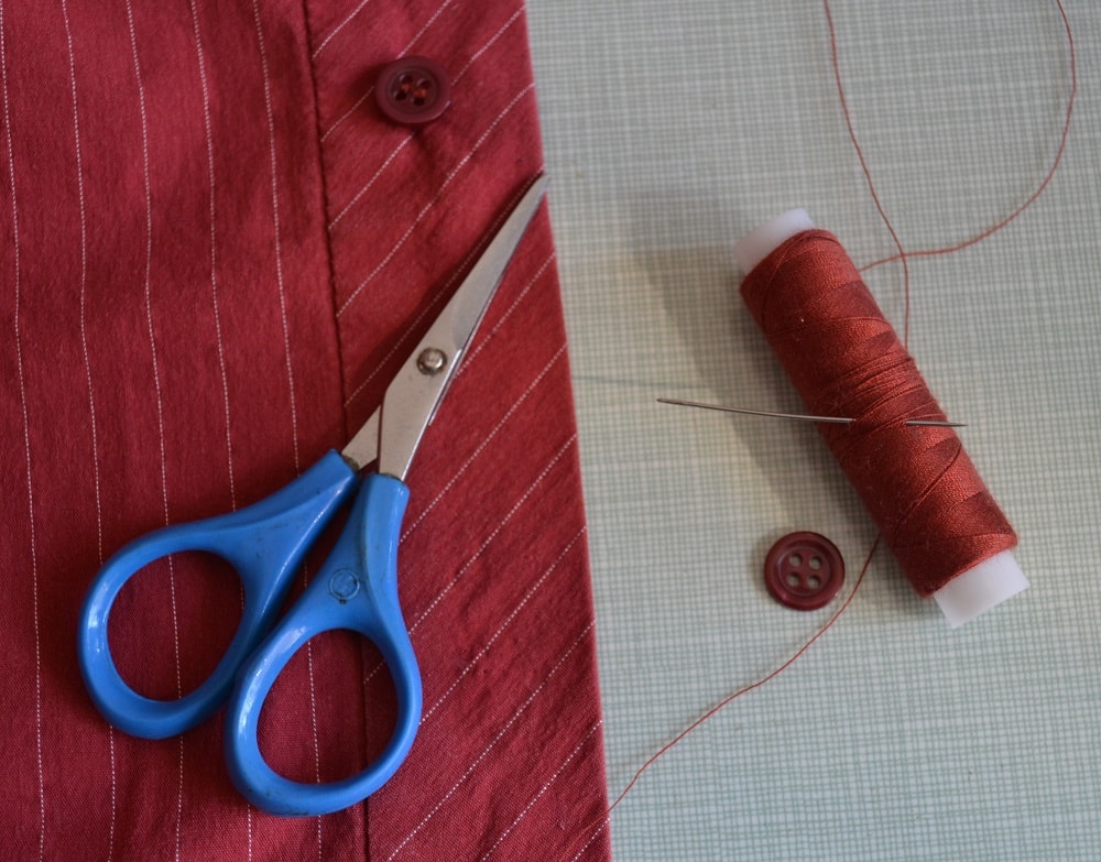 Hand needle, thin thread and small scissors