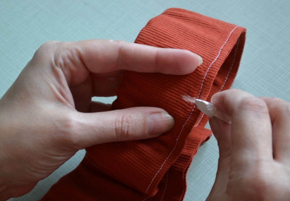 Divide waistband into four segments