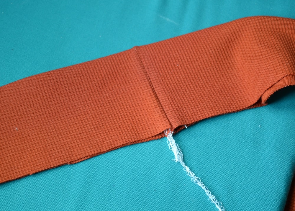 Fold strip in half and press it