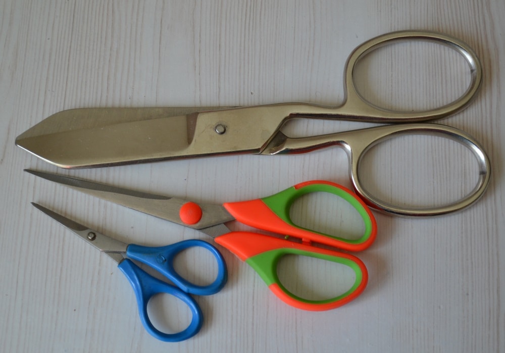 Three scissors having different sizes