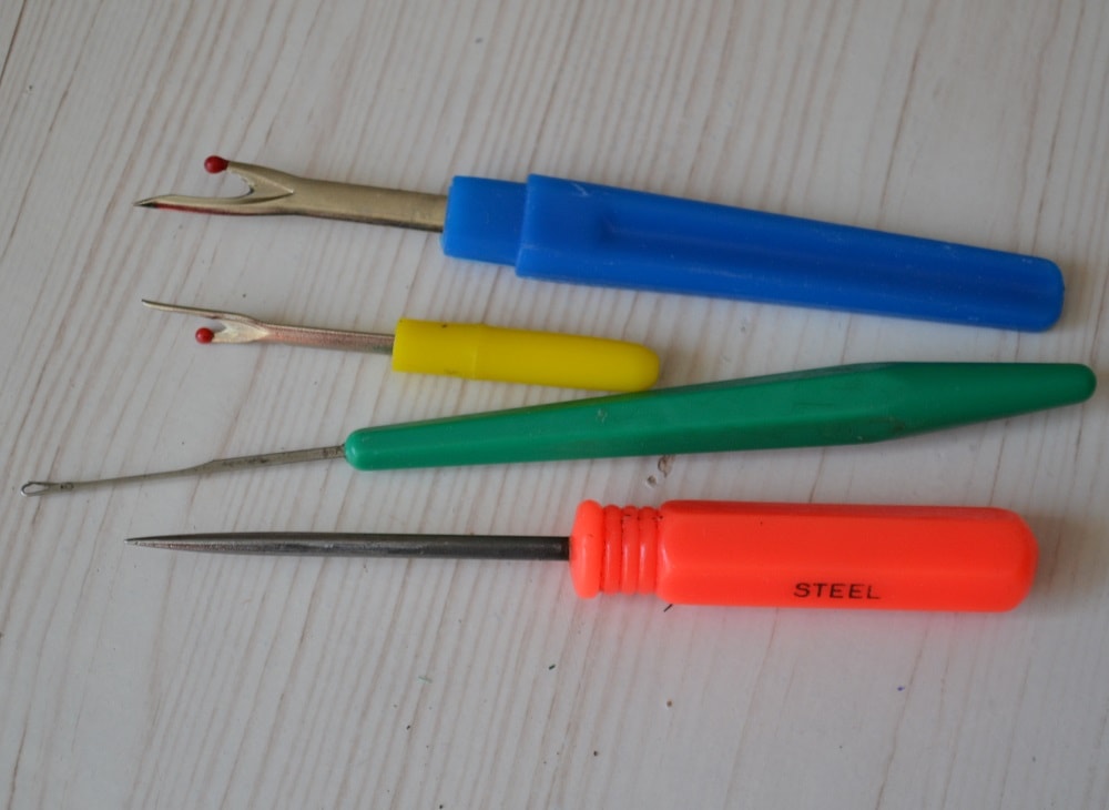 Sewing seam ripper and an awl